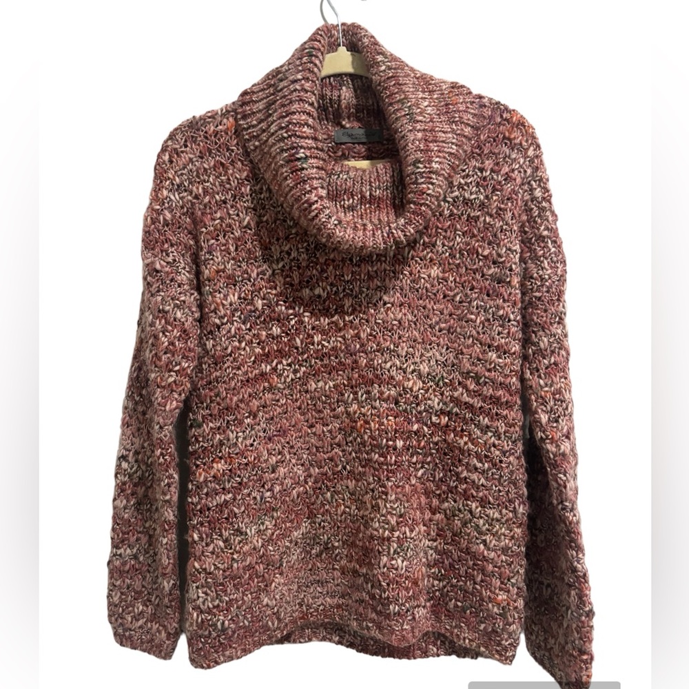 Cozy pink blend turtleneck sweater made in Italy.